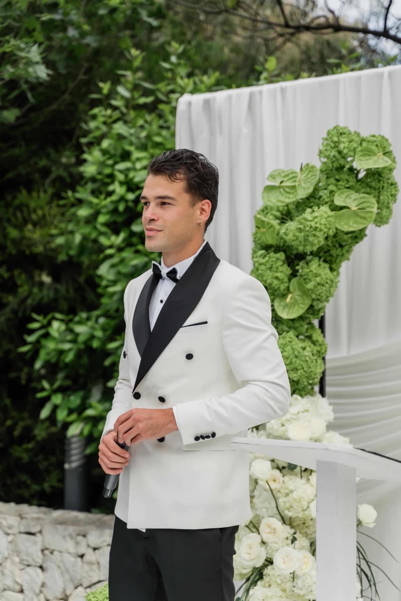 Vova preparing to speak during an outdoor wedding ceremony