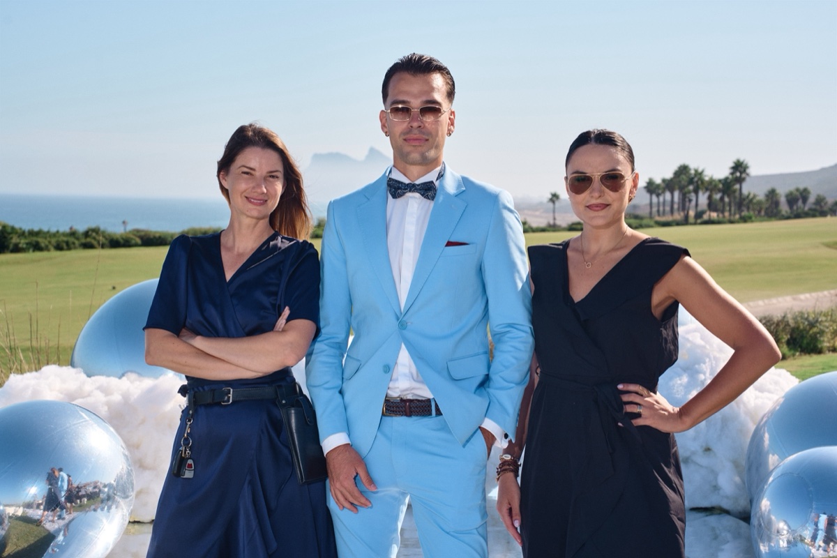 Vova with two members of the wedding team at the cloud-themed venue