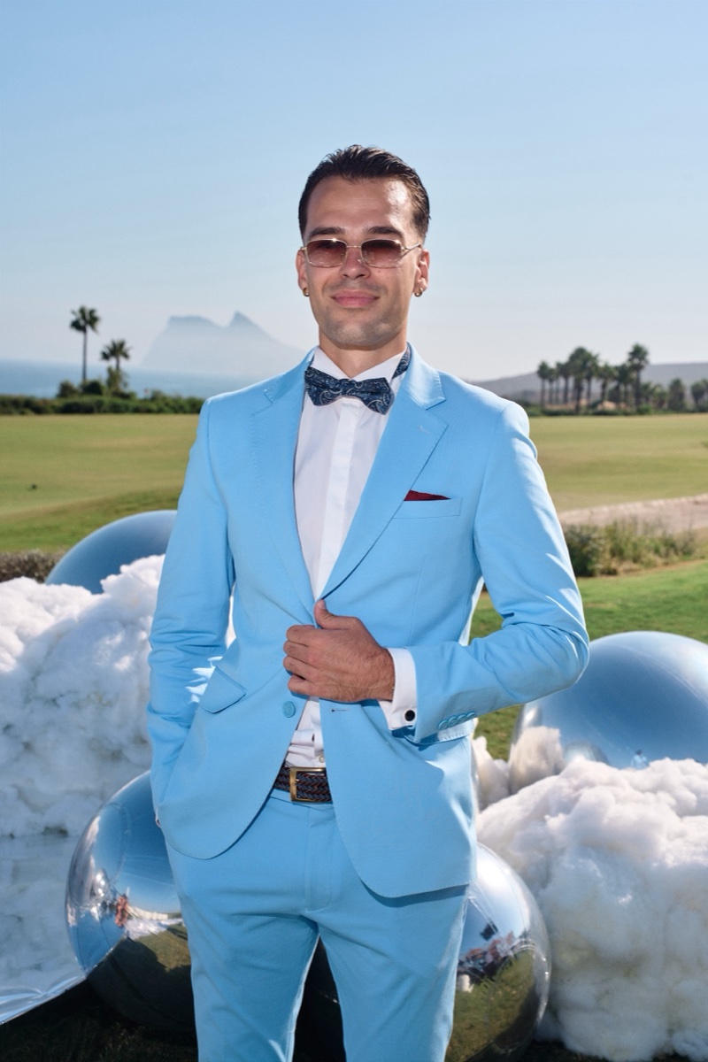 Vova in his sunset-blue suit with the Atlantic behind him