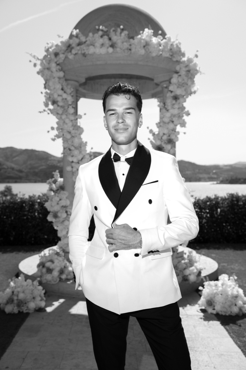 Black-and-white portrait of Vova at the lakeside wedding venue